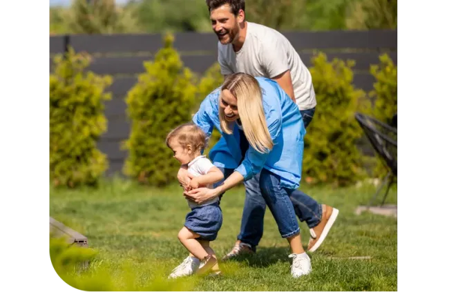 family playing outside yard